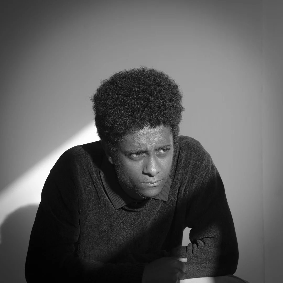Yosef Awgichew in a black-and-white portrait